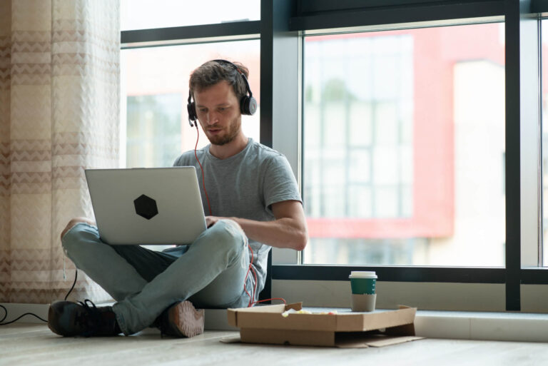 Man working on a laptop with high-speed internet